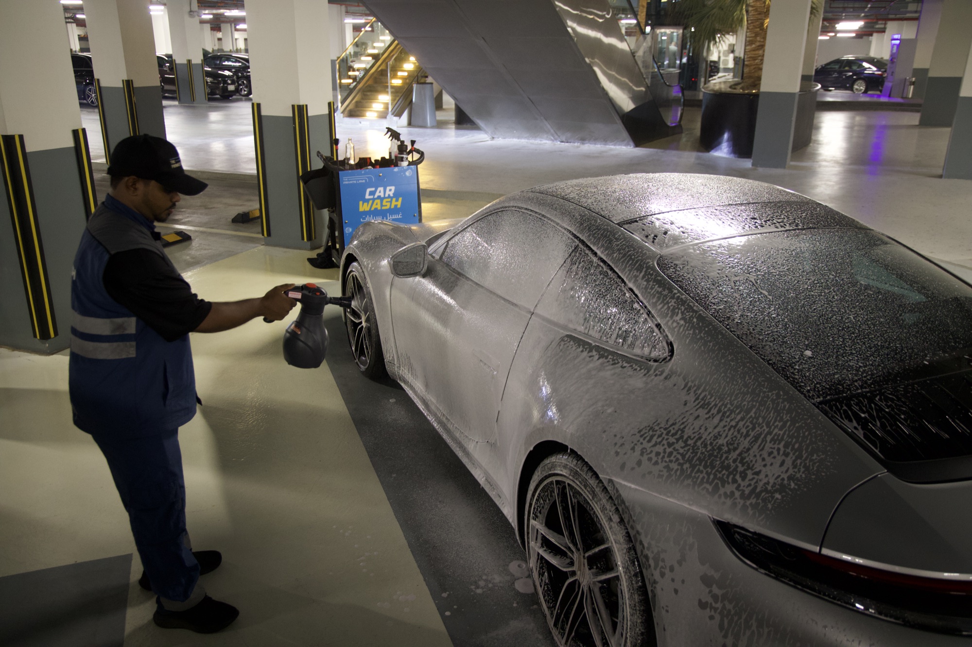 A VPM attendant hand-washing a vehicle at a managed car park