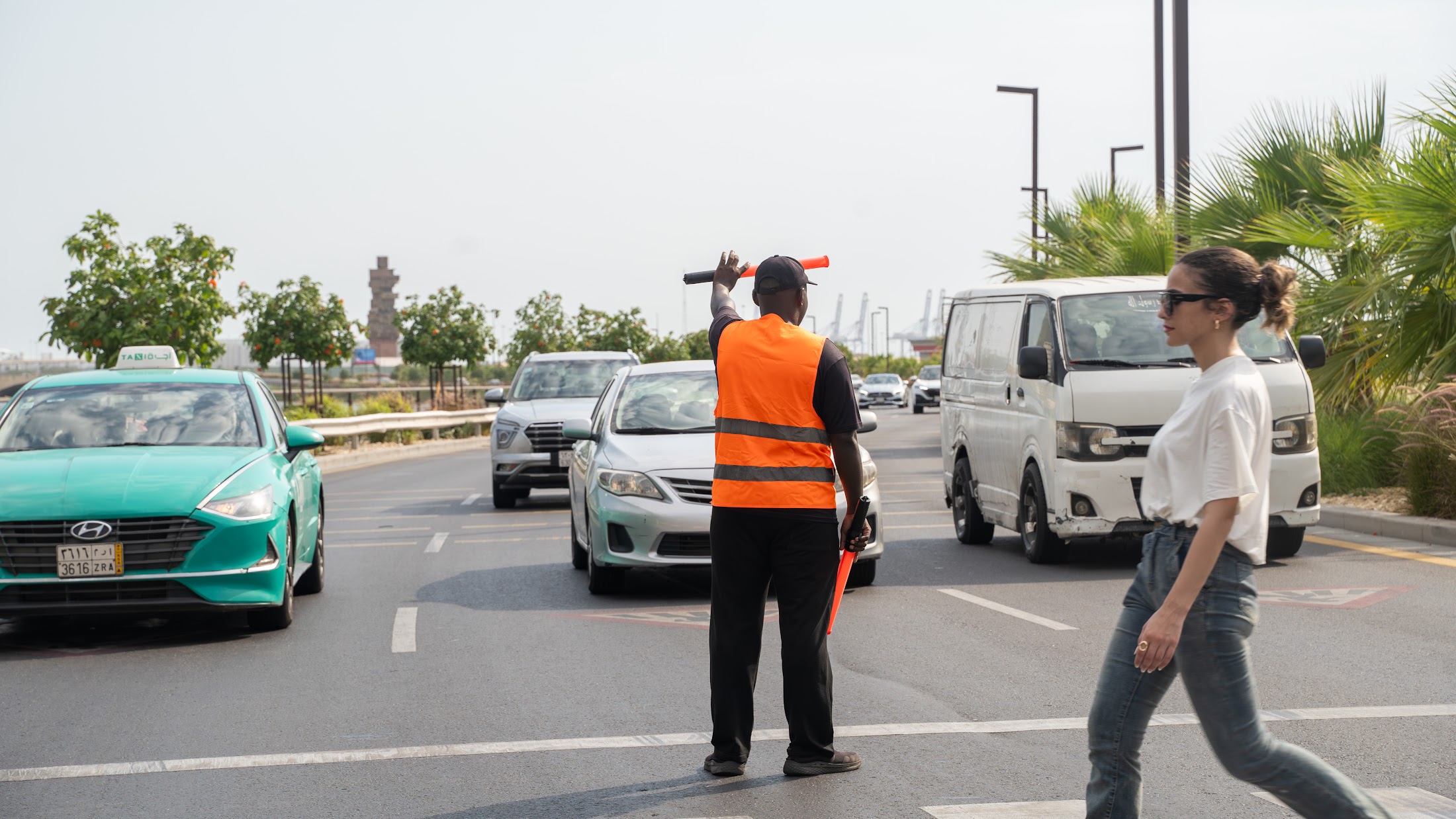 A VPM traffic marshal directing vehicles and pedestrians