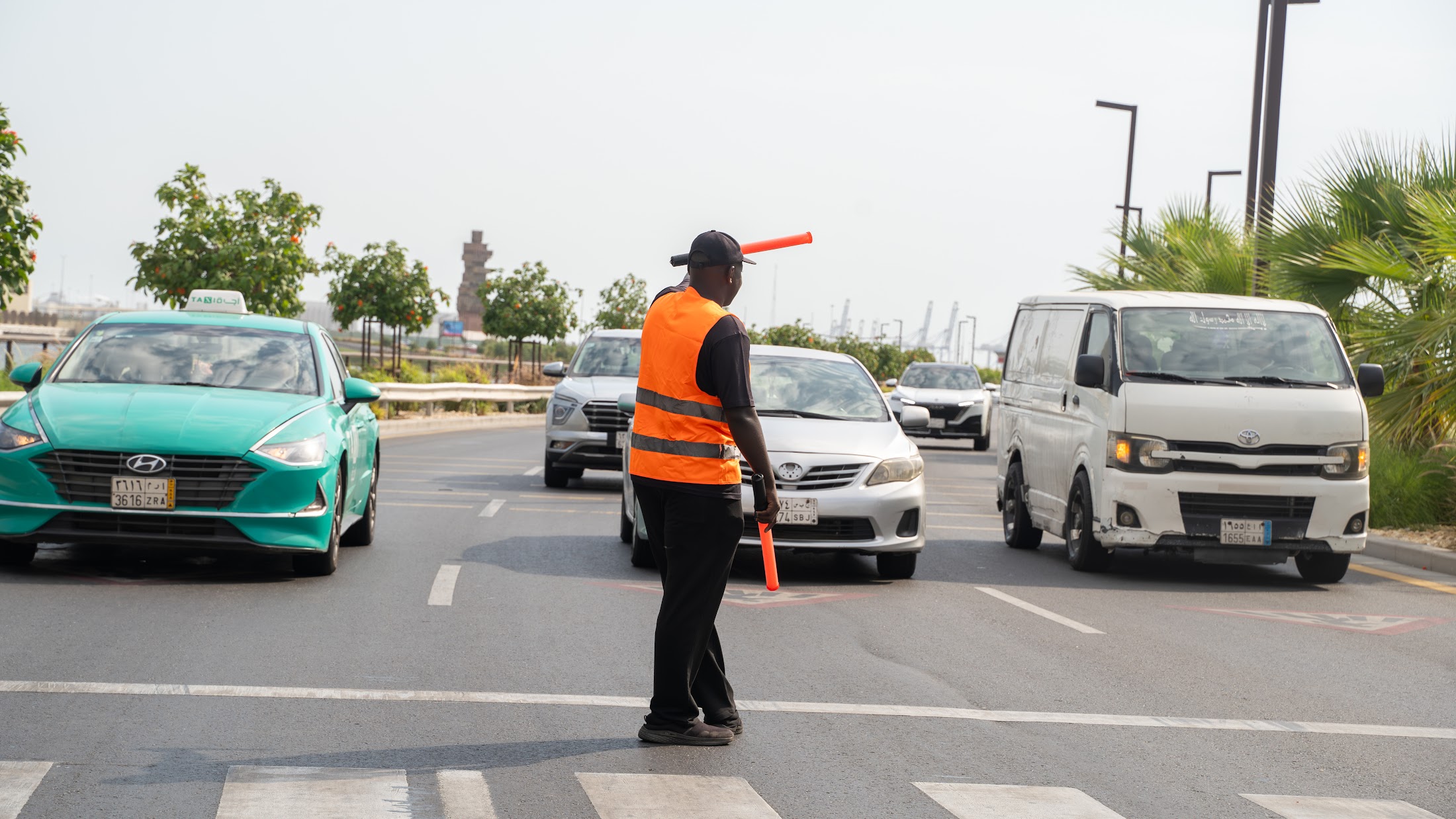 A VPM marshal directing traffic on a busy road